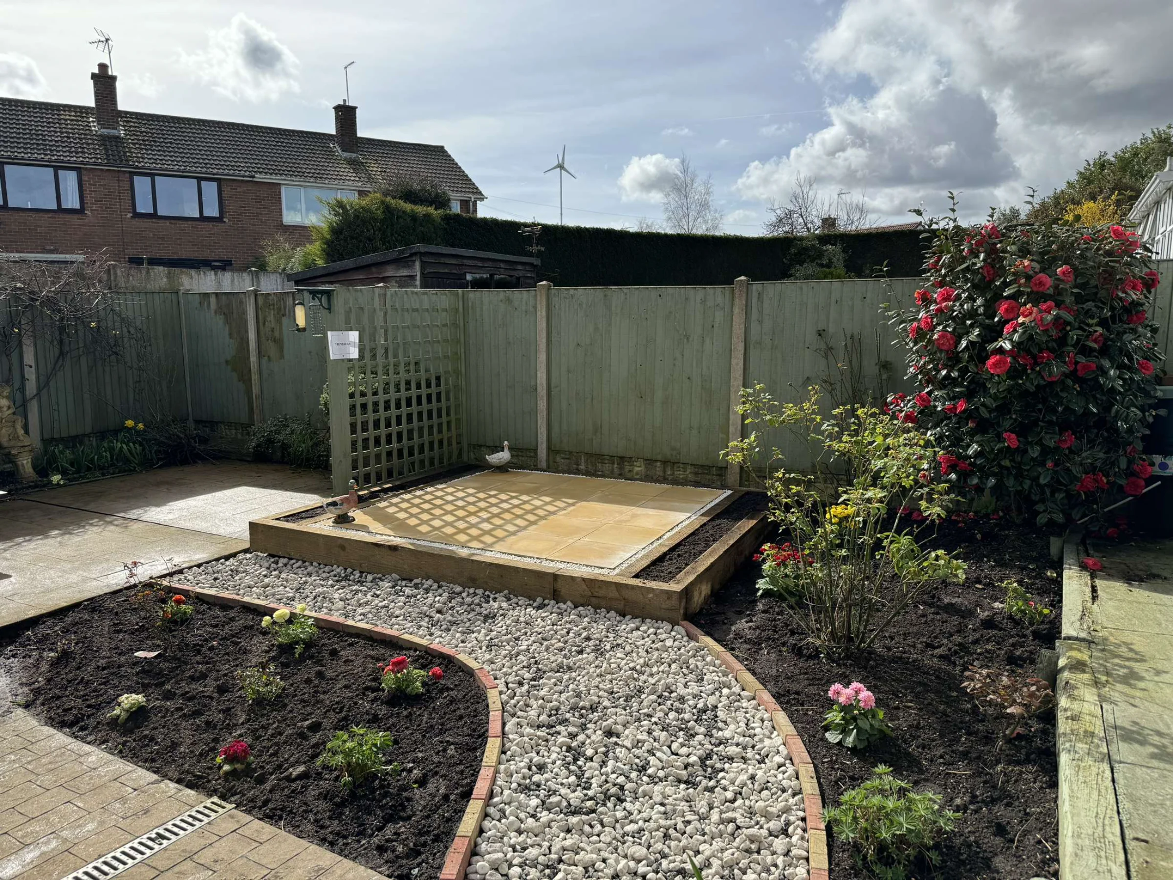New garden landscaping with fresh planting and design features