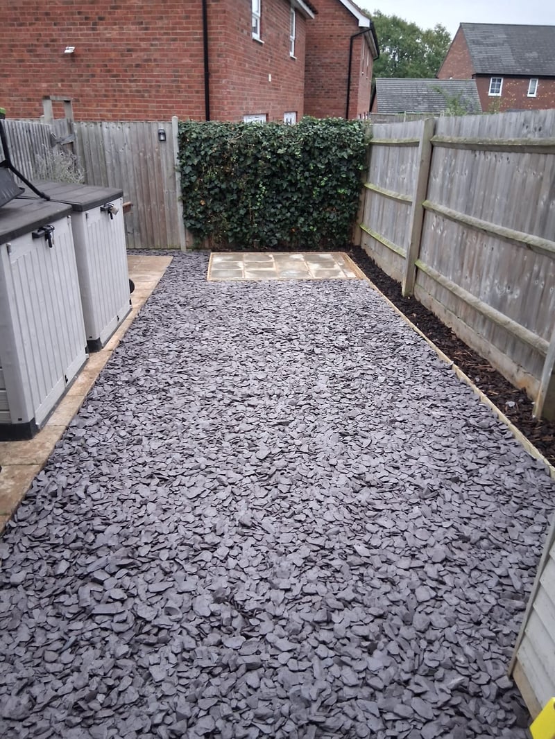 Lawn replaced with blue slate and timber shed base in Derby