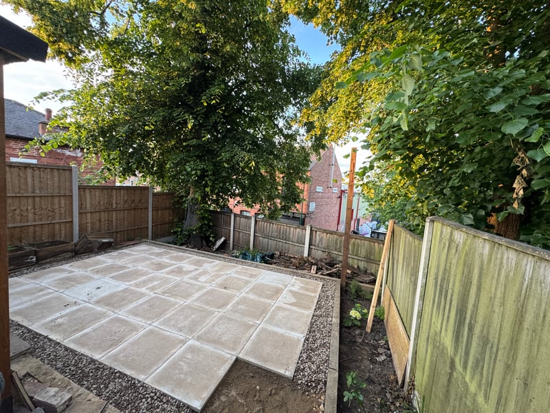 Large new flagstone patio with new fence in Derby