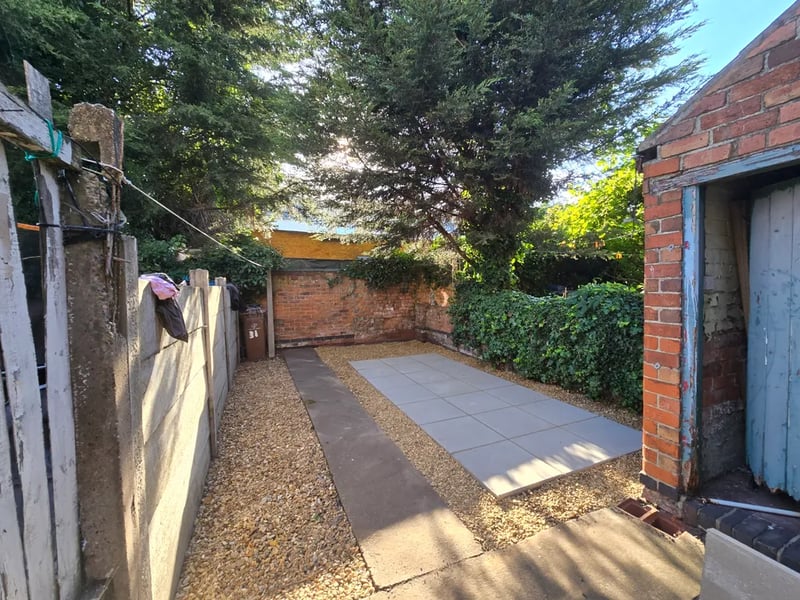 Well-maintained flower borders and lawn edges in a Derby garden